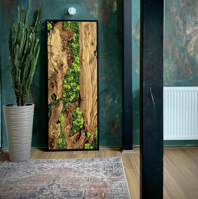 Framed in sleek black wood, this art brings a touch of nature into your home or office. The best part? It requires no maintenance—just enjoy its softness and vibrant hues as they respond naturally to ambient humidity. Plus, it subtly acts as a natural moisture tester!